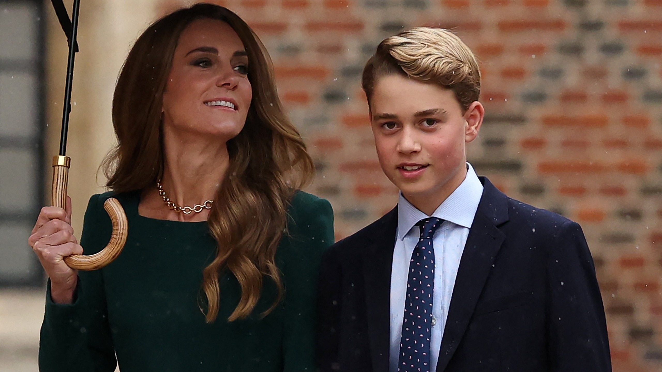 Catherine, Princess of Wales (L) walks with her 13-year-old son, Britain's Prince George of Wales (R), as he arrives for his first day at Eton College, in Eton, west of London, on September 8, 2026