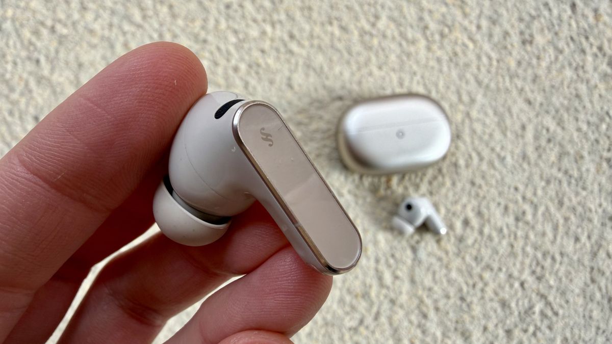 One of the Huawei FreeBuds Pro 5 buds held between fingertips
