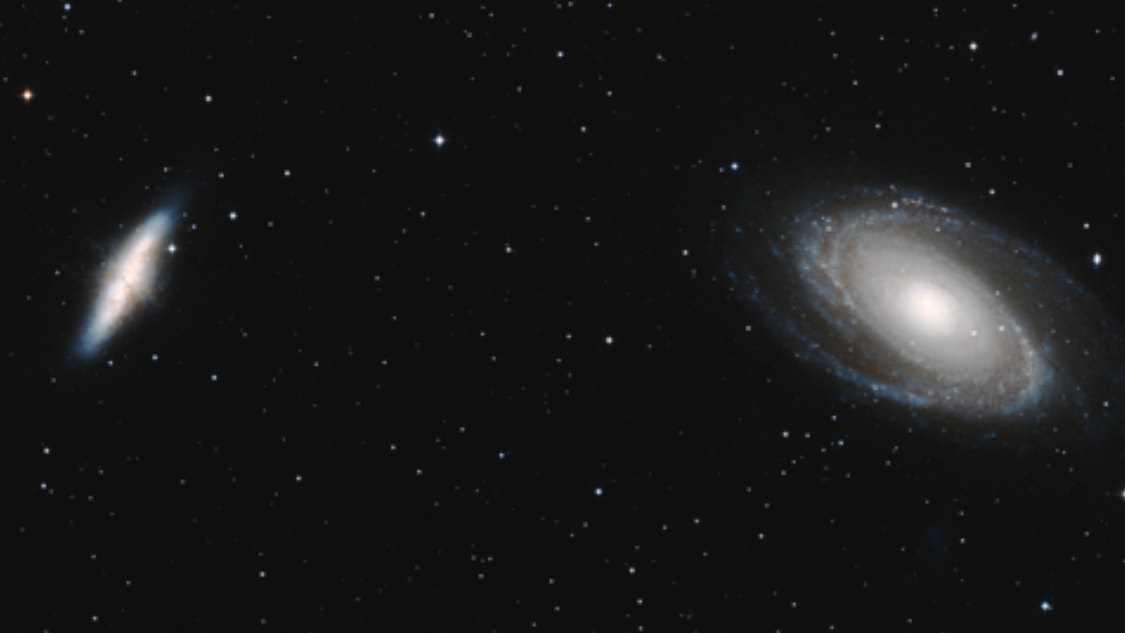 Two bright greatly seperated white swirls against a black background