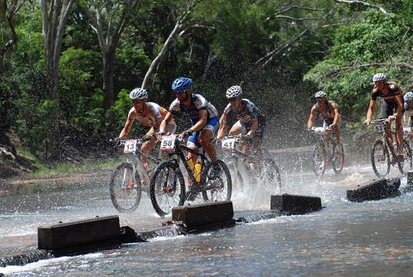 The racers cross a river