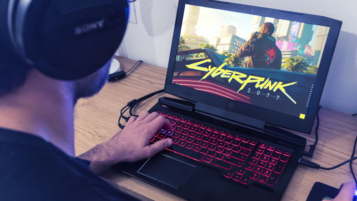 person using a gaming laptop