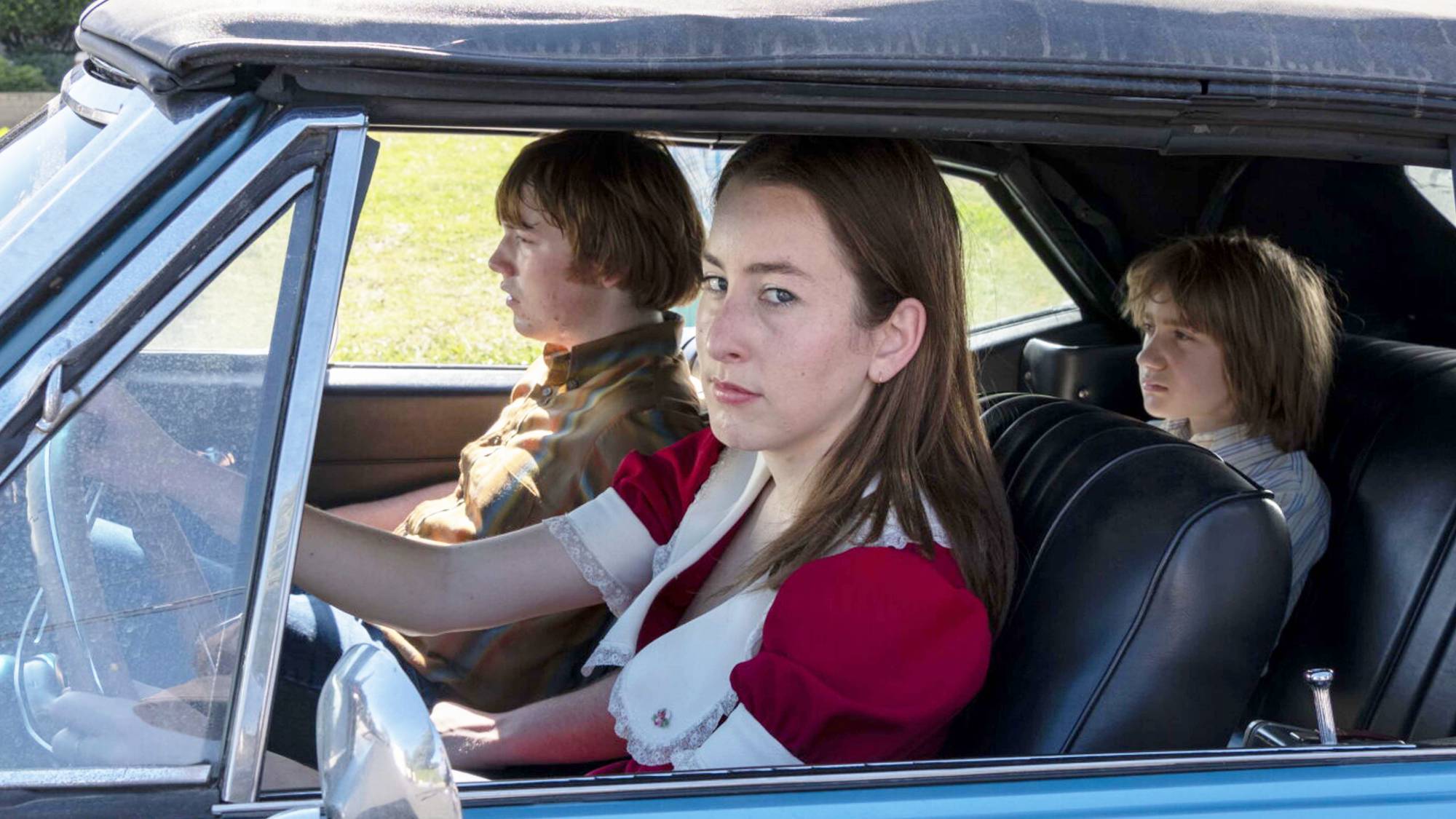 (L-R) Alana Haim as Alana Kane and Cooper Hoffman as Gary Valentine in "Licorice Pizza" now streaming on Prime Video