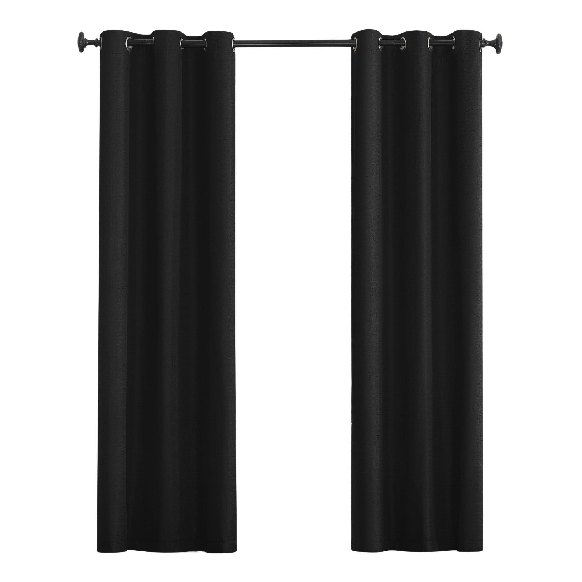 Black blackout curtains on a curtain rail