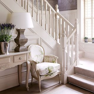 room with staircase and plant in pot