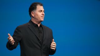 Dell Technologies CEO Michael Dell giving a keynote speech in front of a blue background