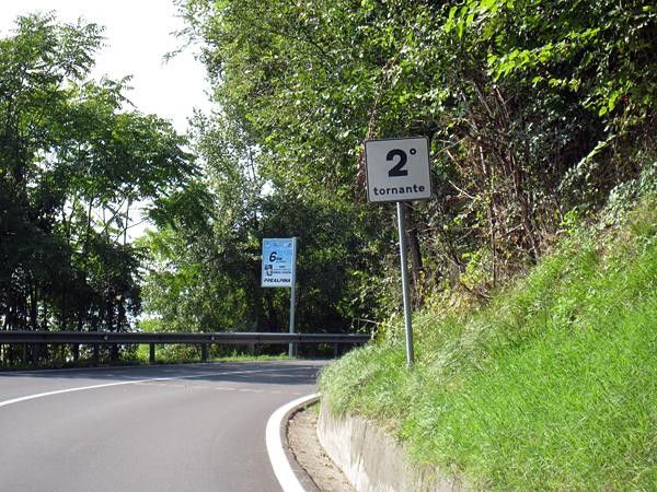 Two switchbacks come at the -6km marker, right after a gentle right and left.