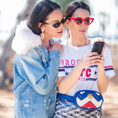 Two women looking at phone