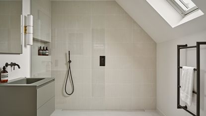 loft bathroom with large shower and pale colours