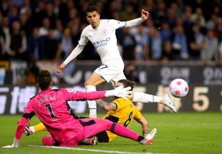 Manchester City’s Joao Cancelo sets up the shot for Raheem Sterling (not pictured) to score their side’s fifth goal of the game during the Premier League match at the Molineux Stadium, Wolverhampton. Picture date: Wednesday May 11, 2022