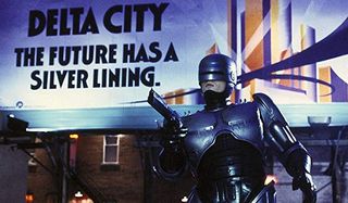 Robocop takes aim in front of a billboard
