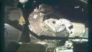 Kimbrough and Whitson work to install axial shields on Node 3.