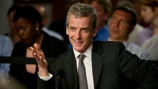 peter capaldi wears a suit and smiles in a still from the thick of it