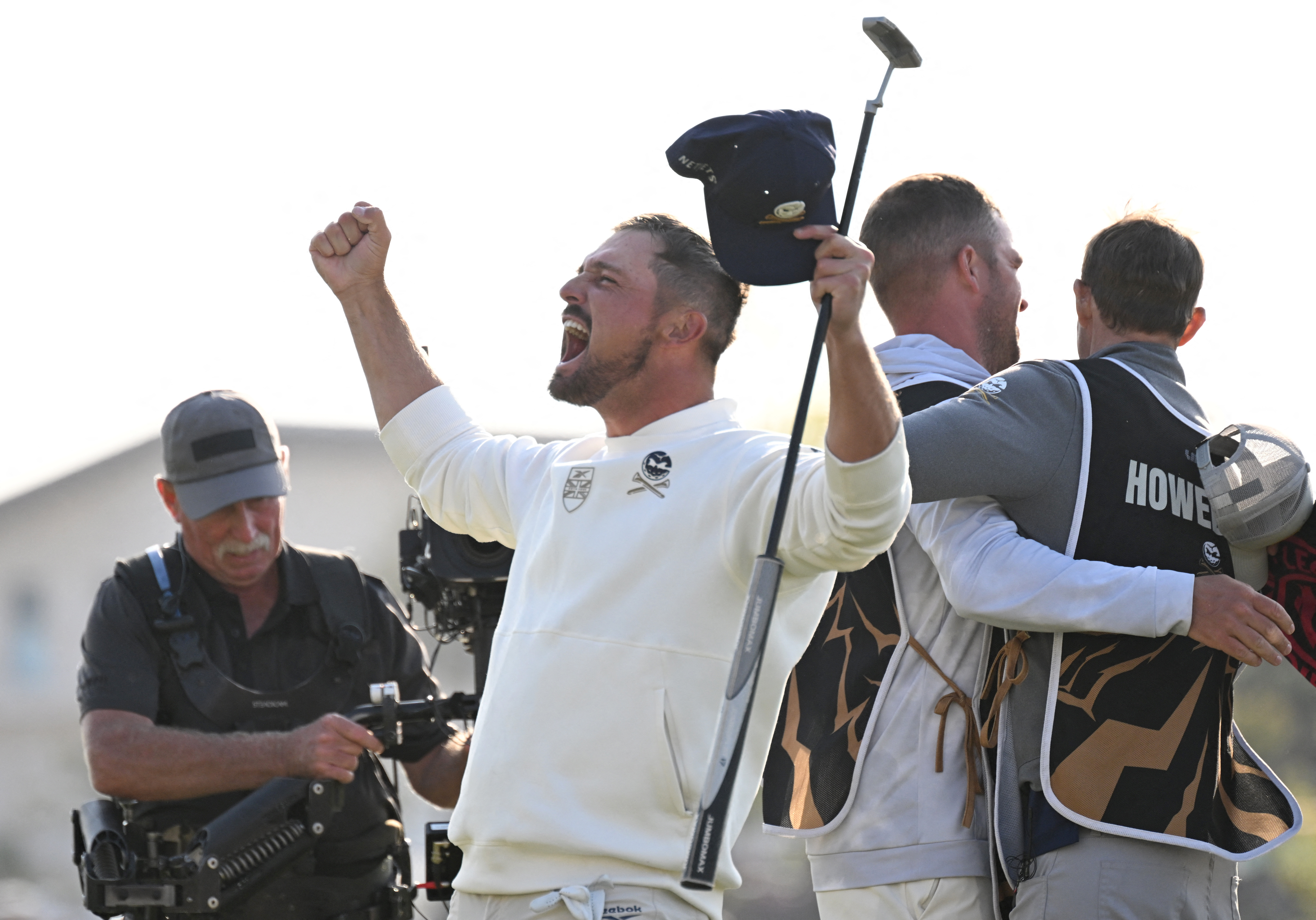 Bryson DeChambeau celebrates after holing a putt