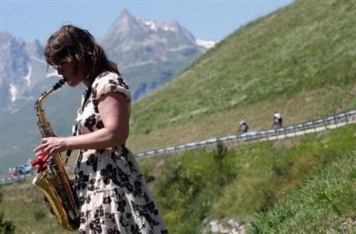 Music to the ears: A Belgian race fans plays road-side,