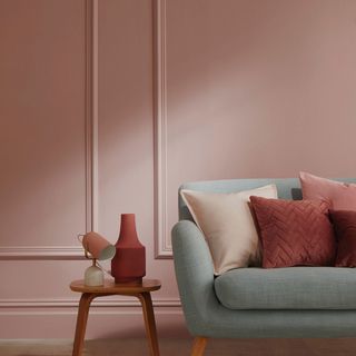 Living room with pink painted panelled walls