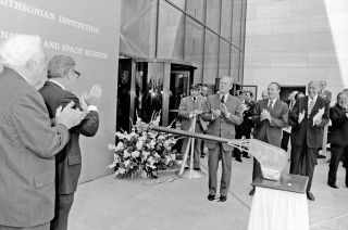 President Gerald Ford and astronaut Michael Collins at the official ribbon cutting outside the National Air and Space Museum on July 1, 1976. The ribbon was cut by a signal transmitted by the Viking I spacecraft in orbit around Mars.