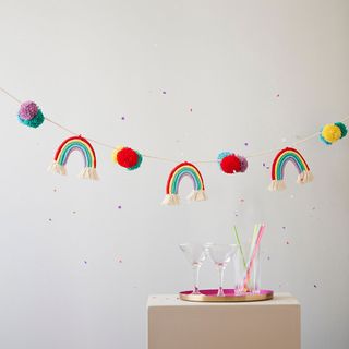 rainbow macrame bunting with pompoms