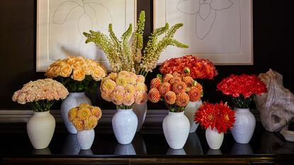 rich hued flowers for fall in white vases