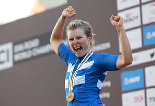Lotta Lepisto celebrates her bronze medal on the podium in Qatar