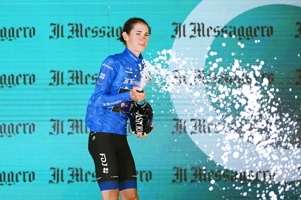 REGGIO EMILIA ITALY JULY 05 Marta Cavalli of Italy and Team FDJ Nouvelle Aquitaine Futuroscope celebrates winning the blue best Italian jersey on the podium ceremony after the 33rd Giro dItalia Donne 2022 Stage 5 a 1261km stage from Carpi to Reggio Emilia GiroDonne UCIWWT on July 05 2022 in Reggio Emilia Italy Photo by Dario BelingheriGetty Images