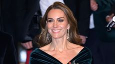 Catherine, Princess of Wales smiles, wearing a velvet dress, as she departs after attending the Royal Variety Performance at Royal Albert Hall on November 19, 2025