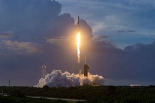 A SpaceX Falcon 9 rocket launches 60 Starlink internet satellites into space from Pad 39A of NASA's Kennedy Space Center in Cape Canaveral, Florida on Oct. 6, 2020. It was the third flight for the Falcon 9 booster.