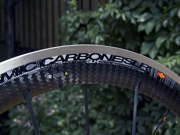 The bonded carbon cap hides a new aluminum rim