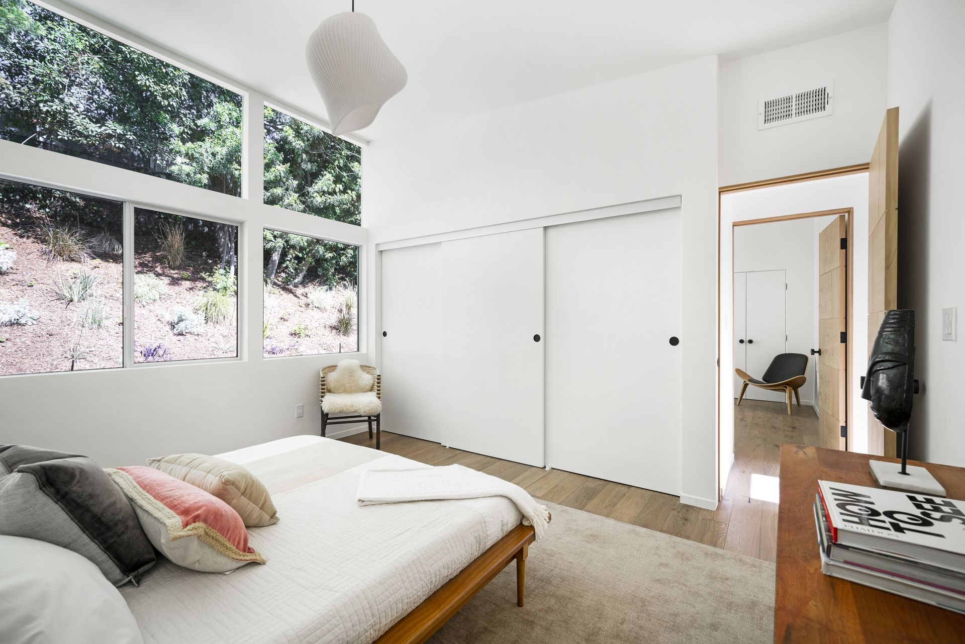 A boho style bedroom with a double closet