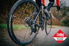 Image shows a rider shifting through his bike gears.