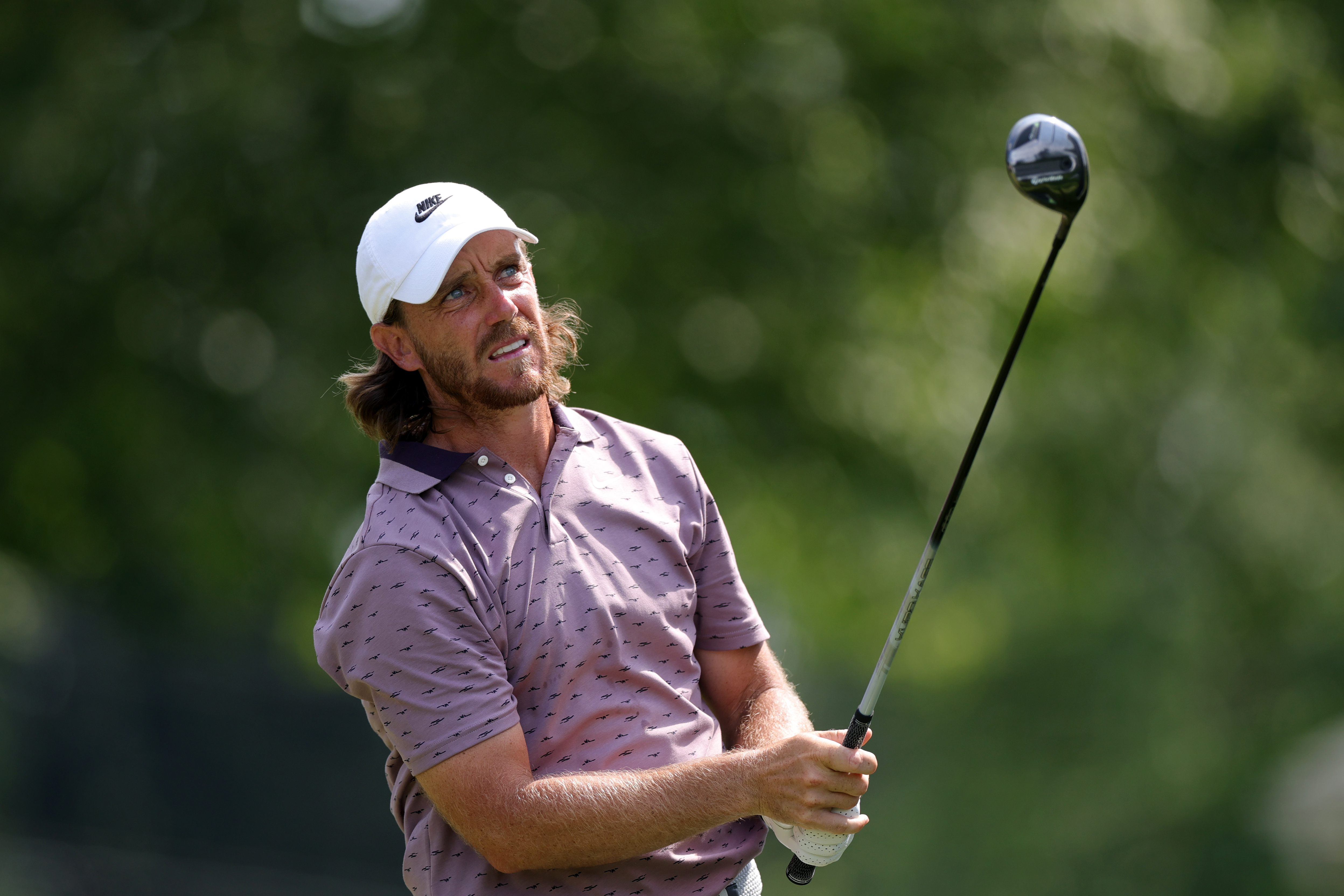 Tommy Fleetwood uses a fairway wood from the fairway
