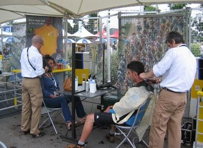 Hair dressers at work in the 'village de d&eacute;part'
