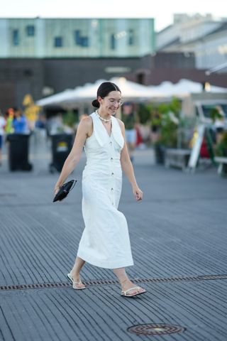 woman in white dress and black sandals