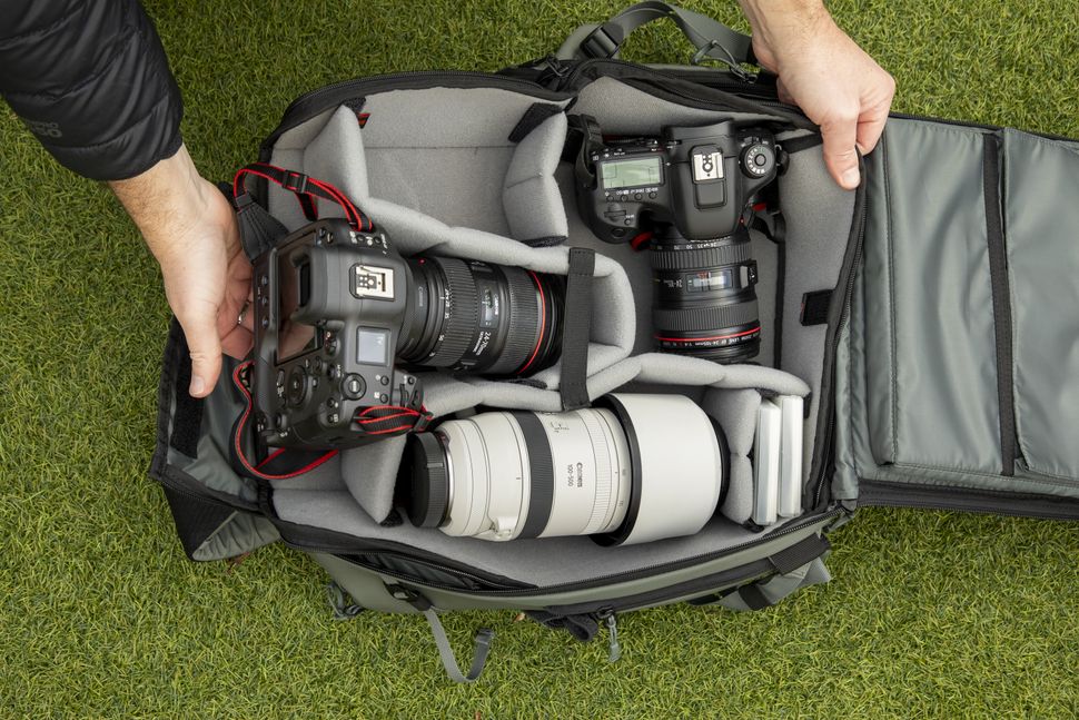 That trendy roll-top camera backpack has two new zip-up siblings. The ...