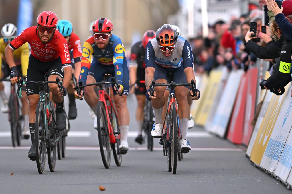 KOKSIJDE BELGIUM MARCH 15 LR Race winner Luca Mozzato of Italy and Team Arkea BB Hotels celebrates at finish line ahead of Dylan Groenewegen of The Netherlands and Team Jayco AlUla during the 22nd Bredene Koksijde Classic 2024 a 2012km one day race from Bredene to Koksijde on March 15 2024 in Koksijde Belgium Photo by Luc ClaessenGetty Images