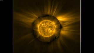 A composite image of the sun consisting of the view of the sun's atmosphere as observed by the Solar Orbiter's EUI instrument and an image of the sun's disk taken by NASA's STEREO spacecraft.
