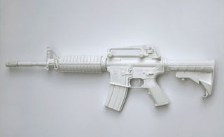 Model of an M4A1 carbine photographed against a white background