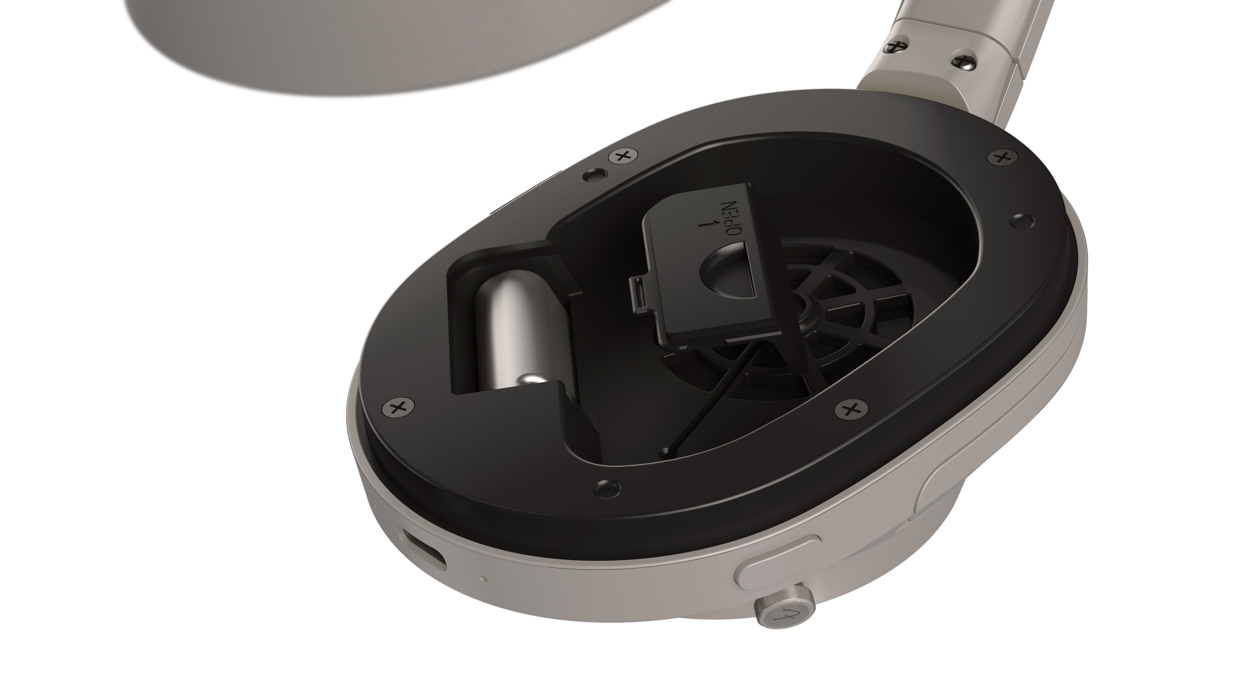 A close-up of the inside of the earcup of the Fender Audio MIX headphones, showing a plug-in transmitter.