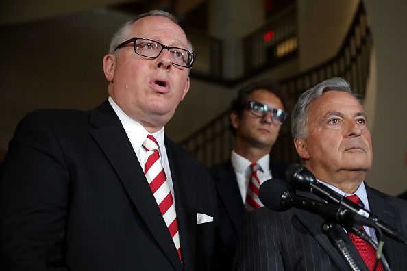 Michael Caputo speaks to the press alongside his lawyer.