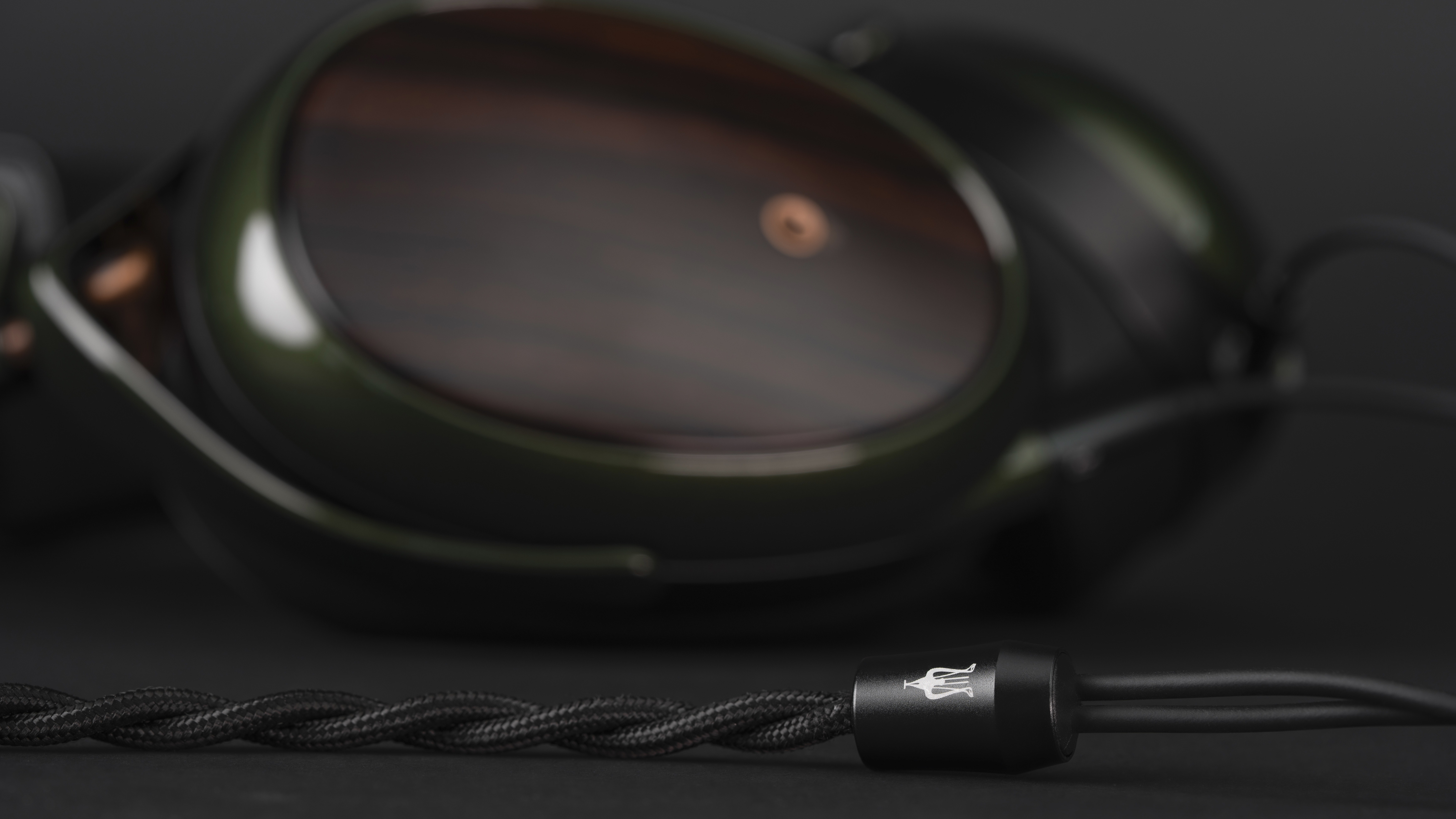 Meze Audio Strada wired headphones closeup of the wire with a Meze logo