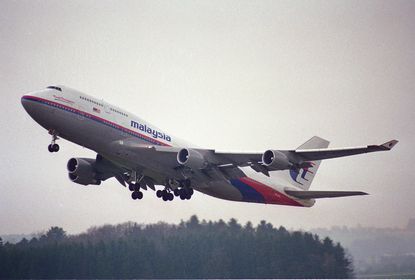 Conspiracy theories spread in the wake of Malaysia Airlines flight disappearance