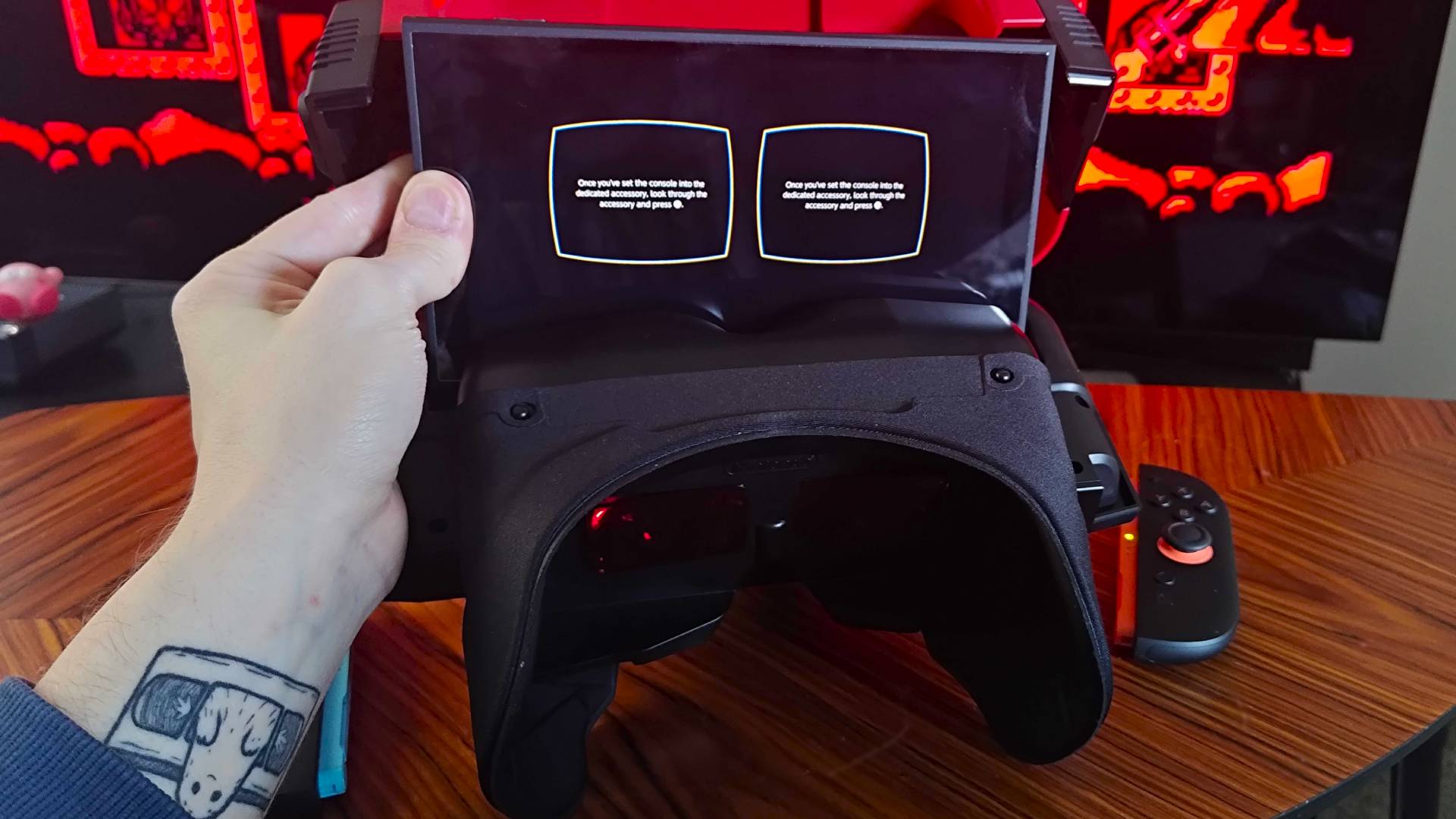 Hand lowering Switch 2 into Virtual Boy.