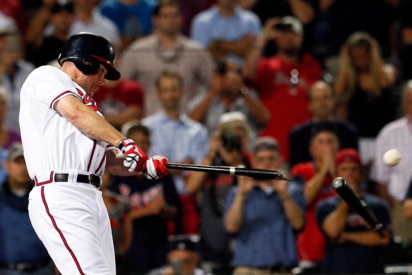 Chipper Jones broke his bat hitting the ball.