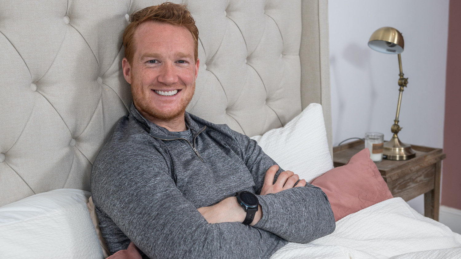 Greg Rutherford lies down on a Dreams Team GB mattress