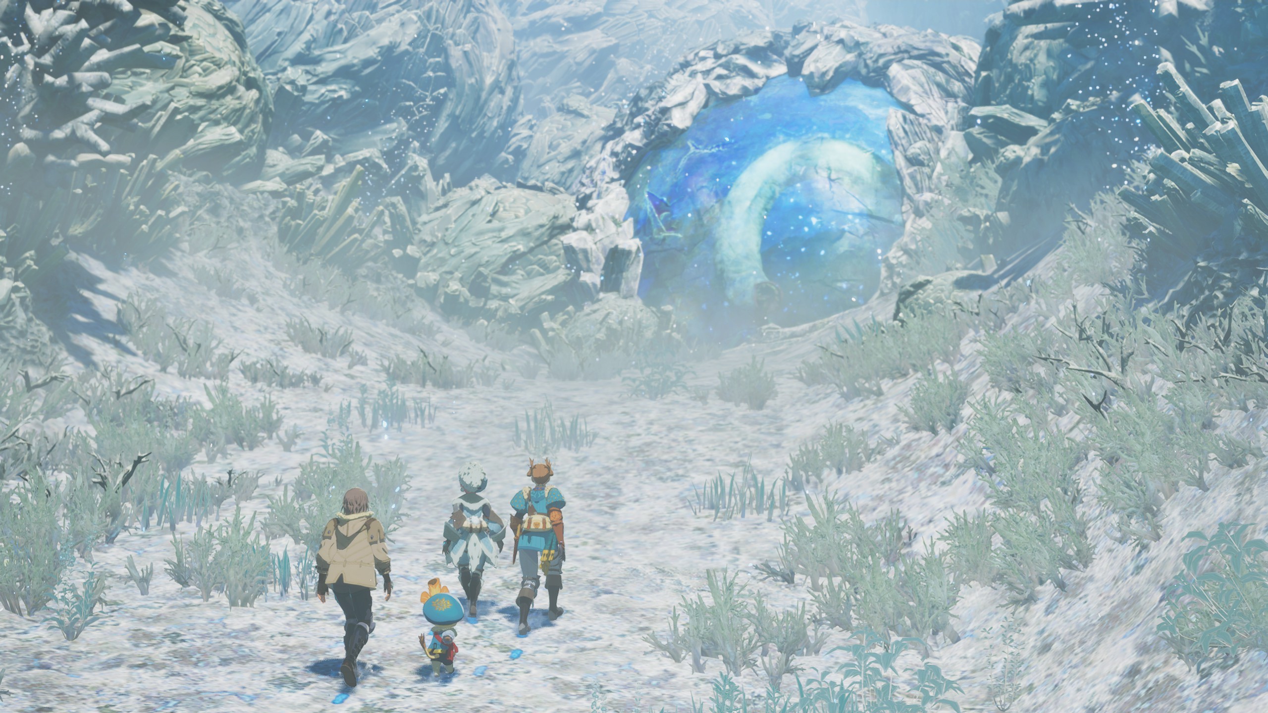 Three characters walk toward a glowing cave in a snowy landscape in Monster Hunter Stories 3: Twisted Reflection