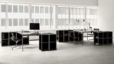 Black and white office furnished with USM Haller system
