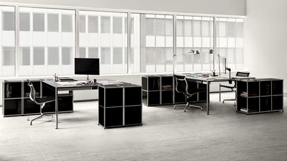 Black and white office furnished with USM Haller system