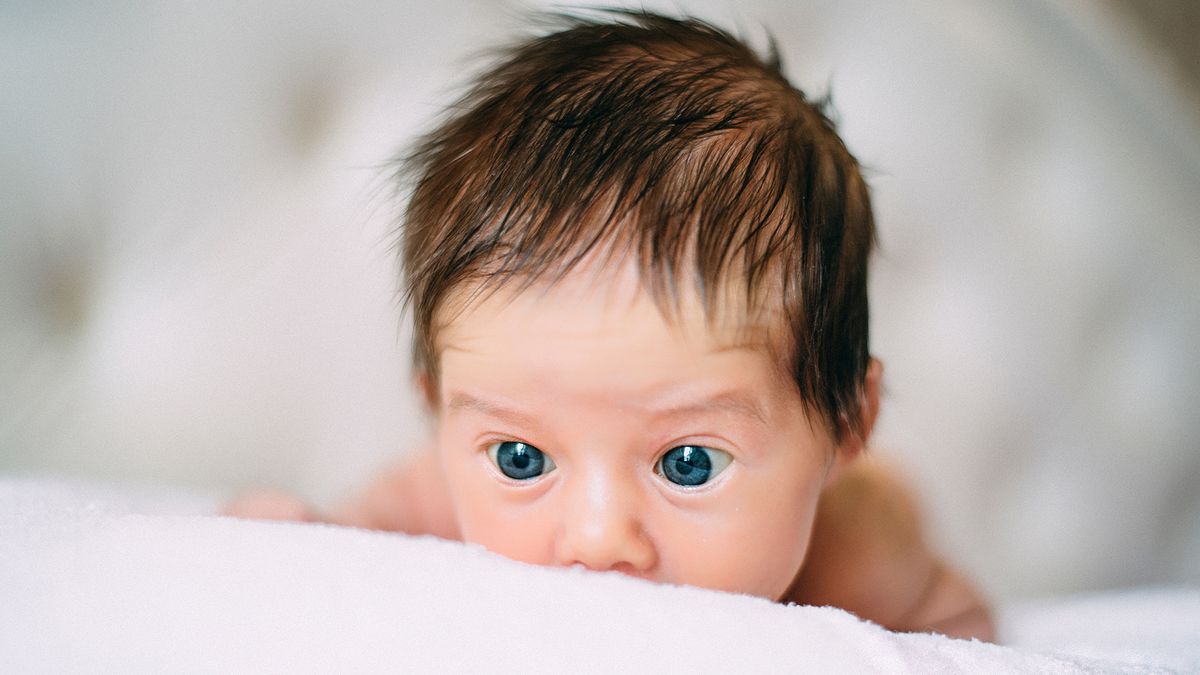 A newborn baby with lots of hair