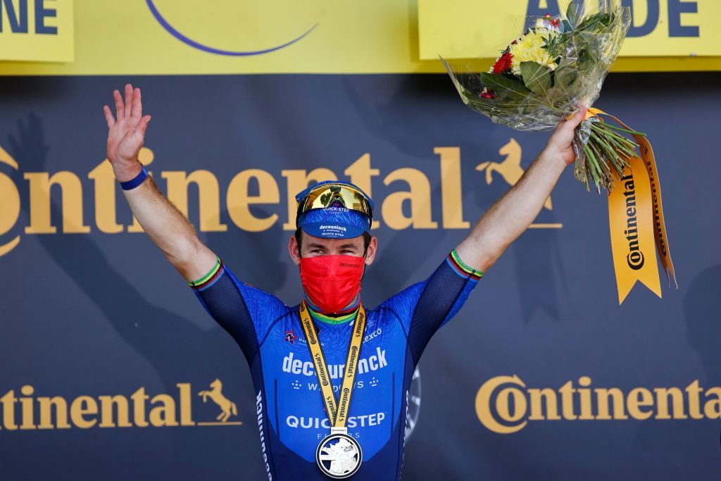Stage winner Team Deceuninck Quicksteps Mark Cavendish of Great Britain celebrates on the podium after winning the 13th stage of the 108th edition of the Tour de France cycling race 219 km between Nimes and Carcassonne on July 9 2021 Photo by Thomas SAMSON AFP Photo by THOMAS SAMSONAFP via Getty Images