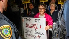 Houston Police officers keep an eye on demonstrators during a protest against ICE in Houston in January 2026