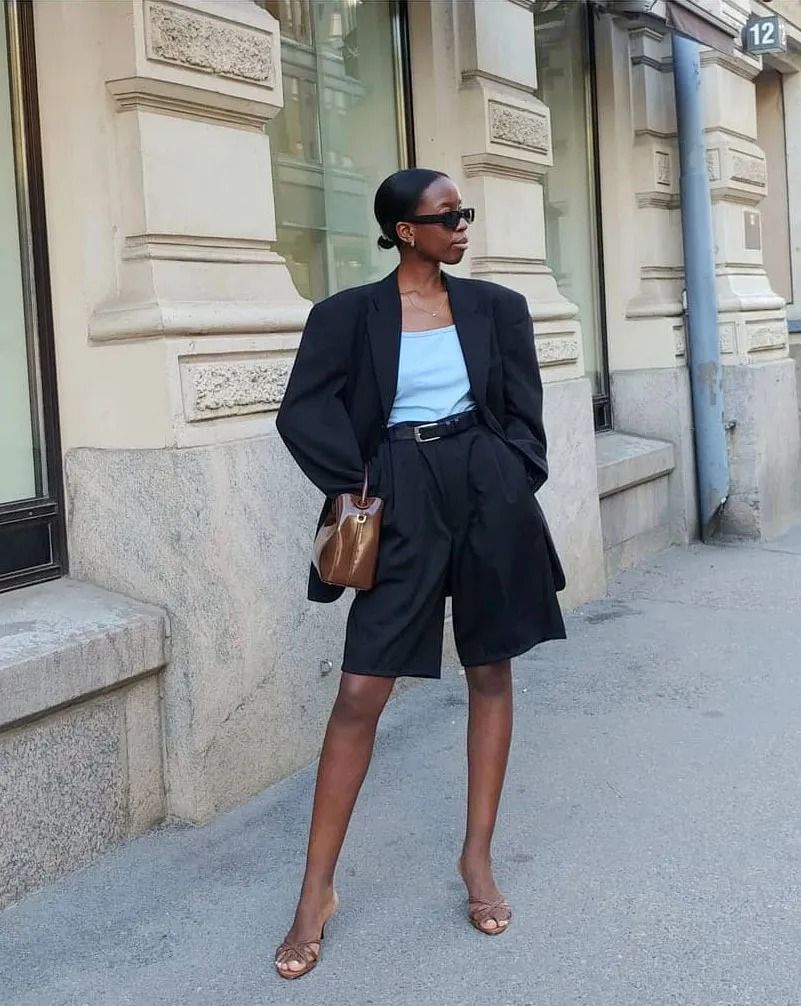 a woman wears long shorts